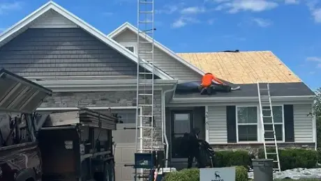 Strong winds damage roofs in Batavia